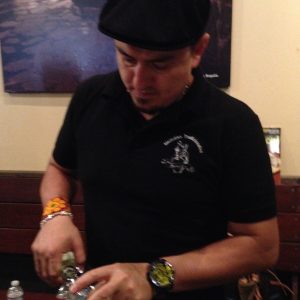 Erick "Almamezcalera" Rodriguez pours at Ruta del Mezcal