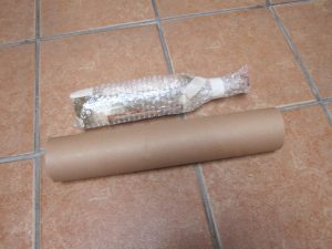 For extra security wrap bottles in bubble wrap before inserting them into a poster tube. 