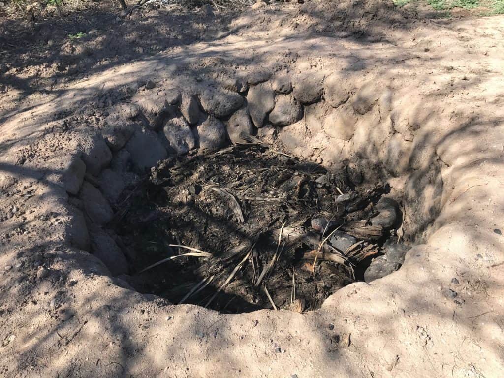 What is bacanora? Here we see a pit oven for roasting agave