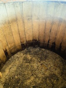 How fermentation tanks influence the  flavor of mezcal